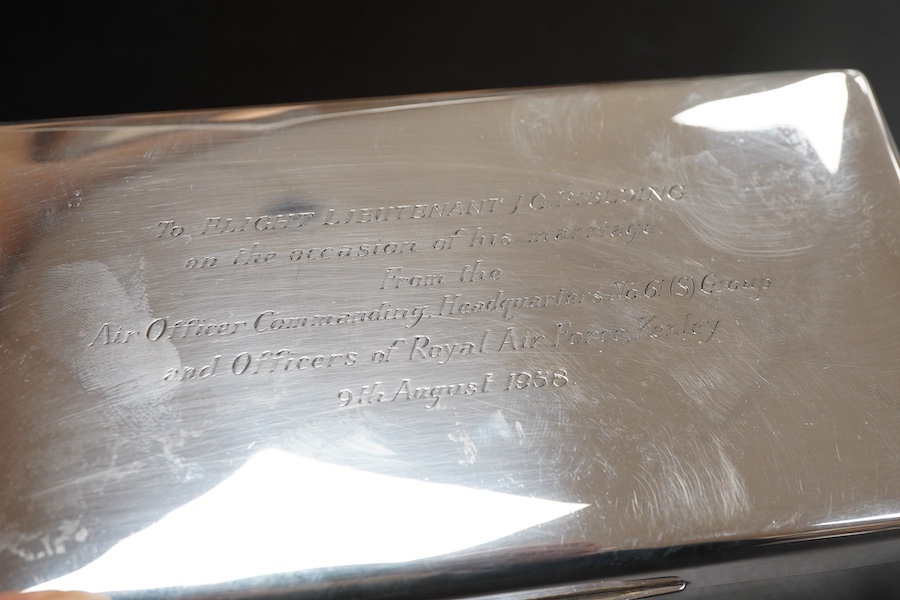 An Elizabeth II silver mounted rectangular cigarette box, with R.A.F. related engraved inscription, Sheffield, 1957, 17.7cm.